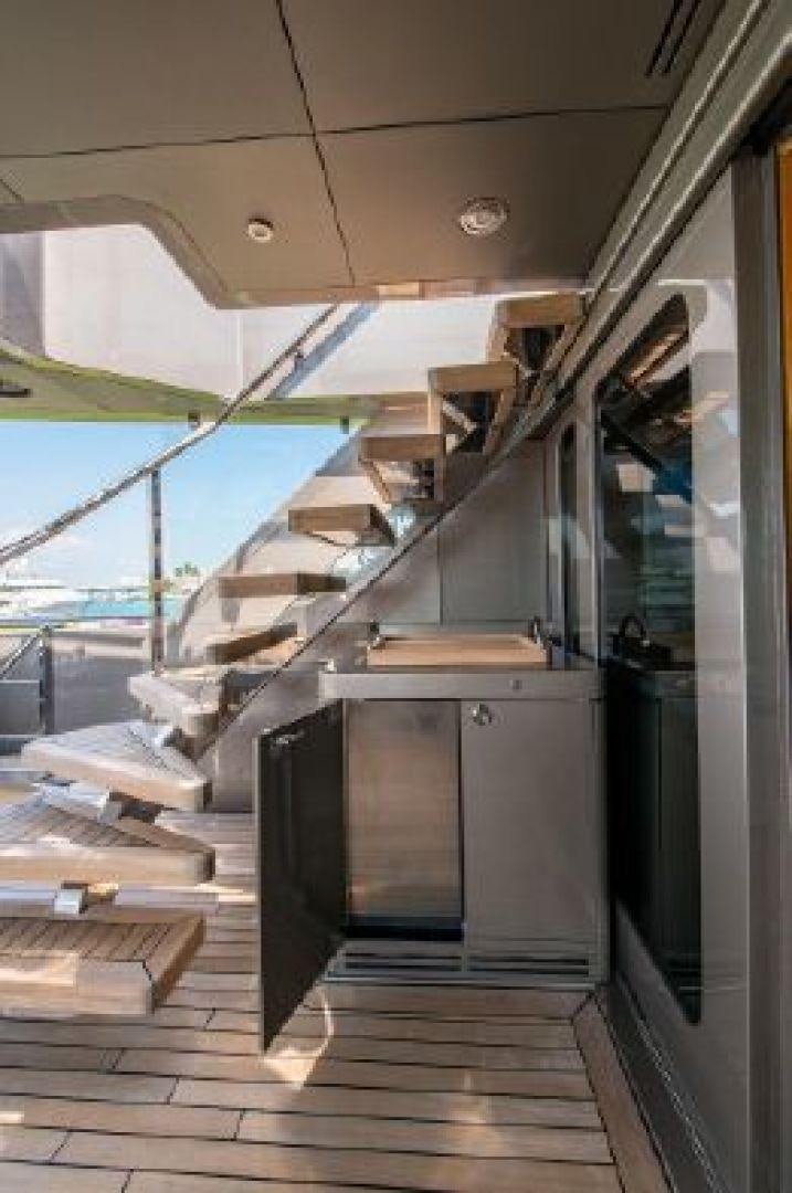 a room with a wood floor and a large window with a view of the ocean aboard 174 OCEANFAST MIZU Yacht for Sale