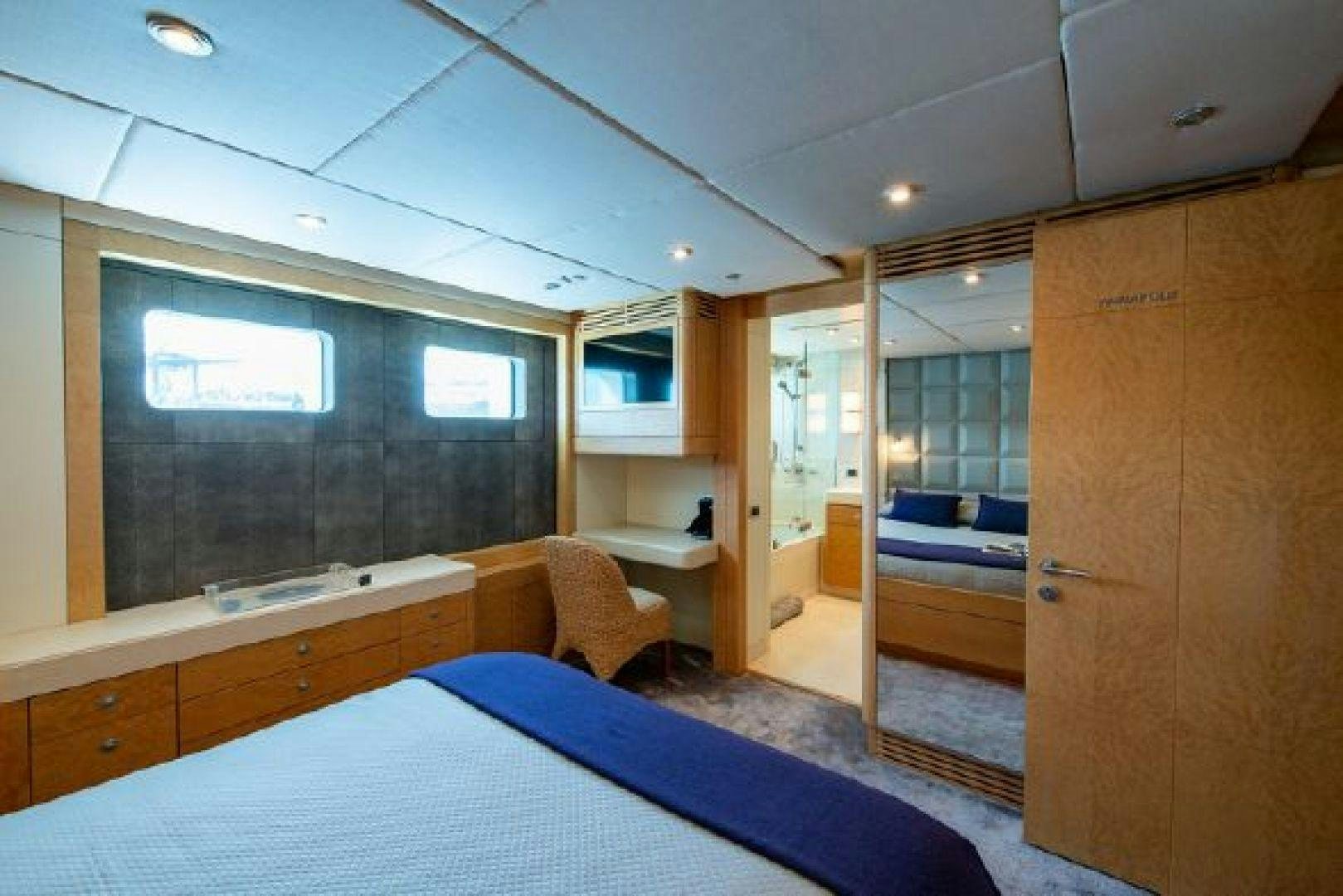 a room with a bed and a desk aboard 174 OCEANFAST MIZU Yacht for Sale