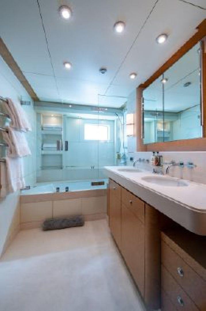 a bathroom with a large mirror aboard 174 OCEANFAST MIZU Yacht for Sale