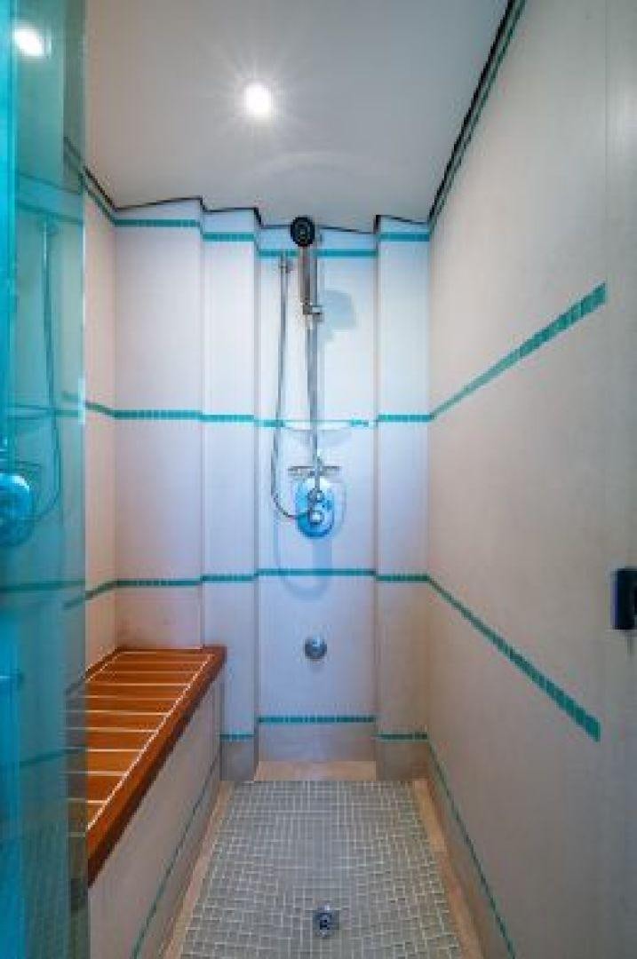 a shower with a tile floor aboard 174 OCEANFAST MIZU Yacht for Sale