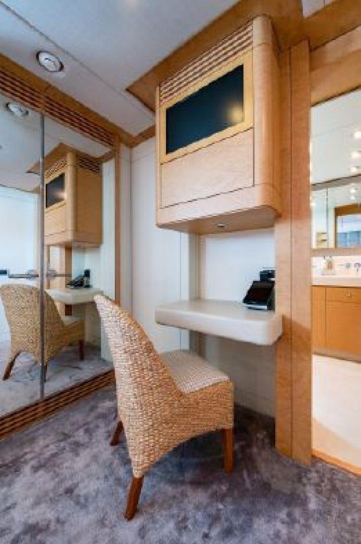 a chair and a table in a room aboard 174 OCEANFAST MIZU Yacht for Sale