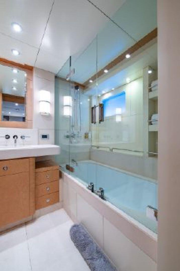 a bathroom with a tub and sink aboard 174 OCEANFAST MIZU Yacht for Sale