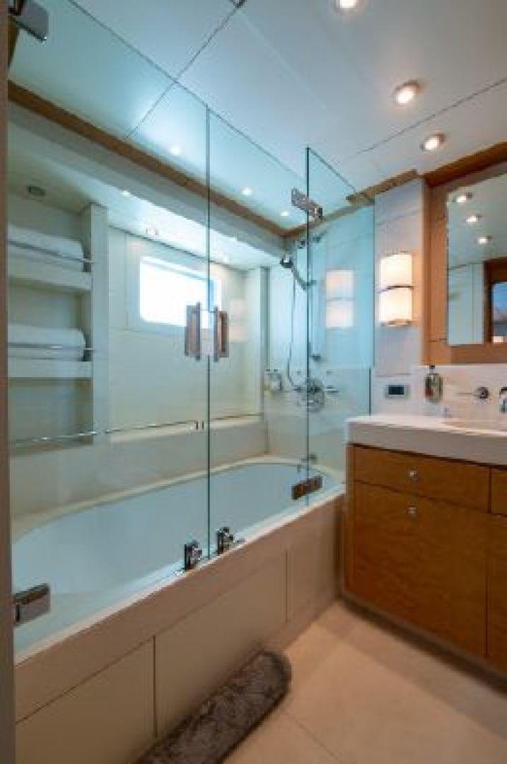 a bathroom with a glass shower aboard 174 OCEANFAST MIZU Yacht for Sale