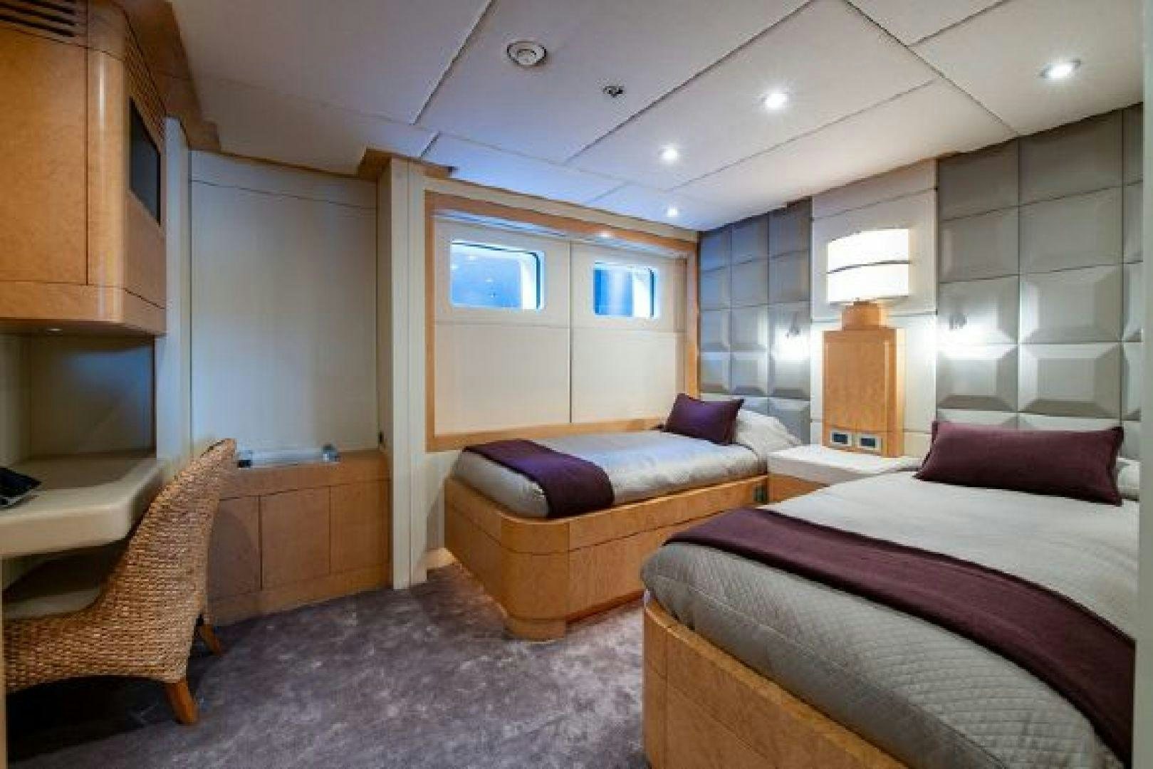 a bedroom with a bed and a couch aboard 174 OCEANFAST MIZU Yacht for Sale