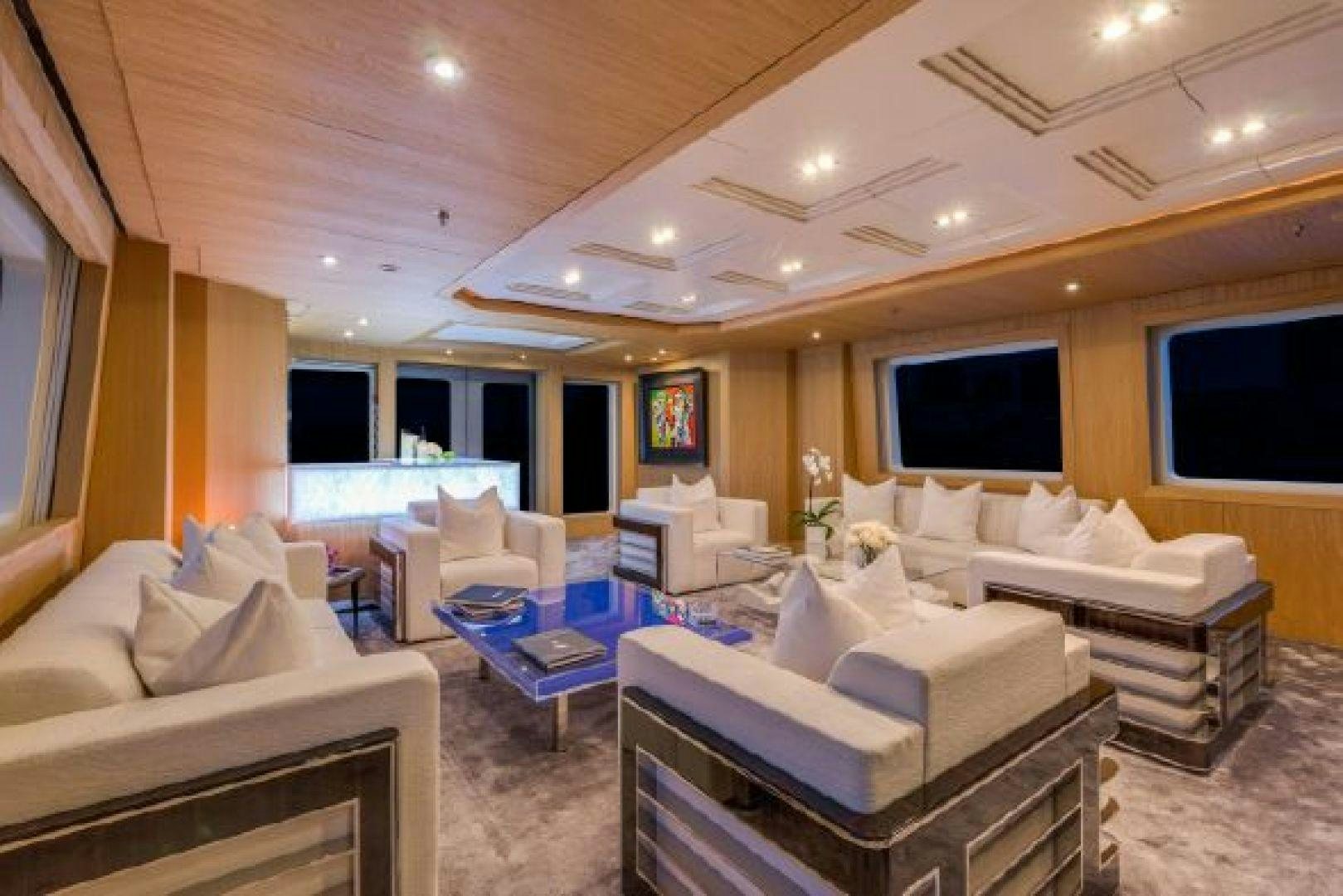 a living room with a large screen aboard 174 OCEANFAST MIZU Yacht for Sale