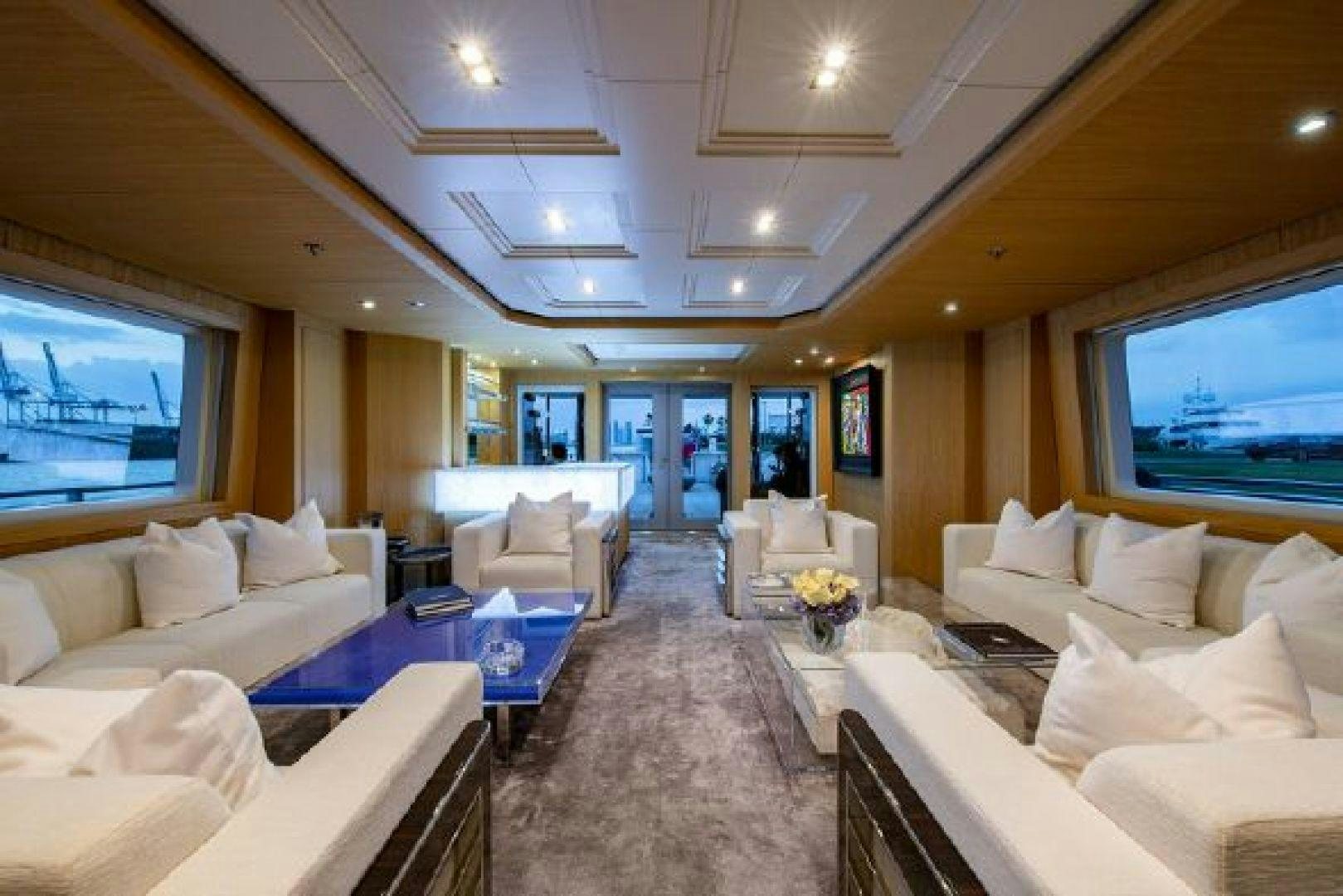 a living room with white couches and a tv aboard 174 OCEANFAST MIZU Yacht for Sale