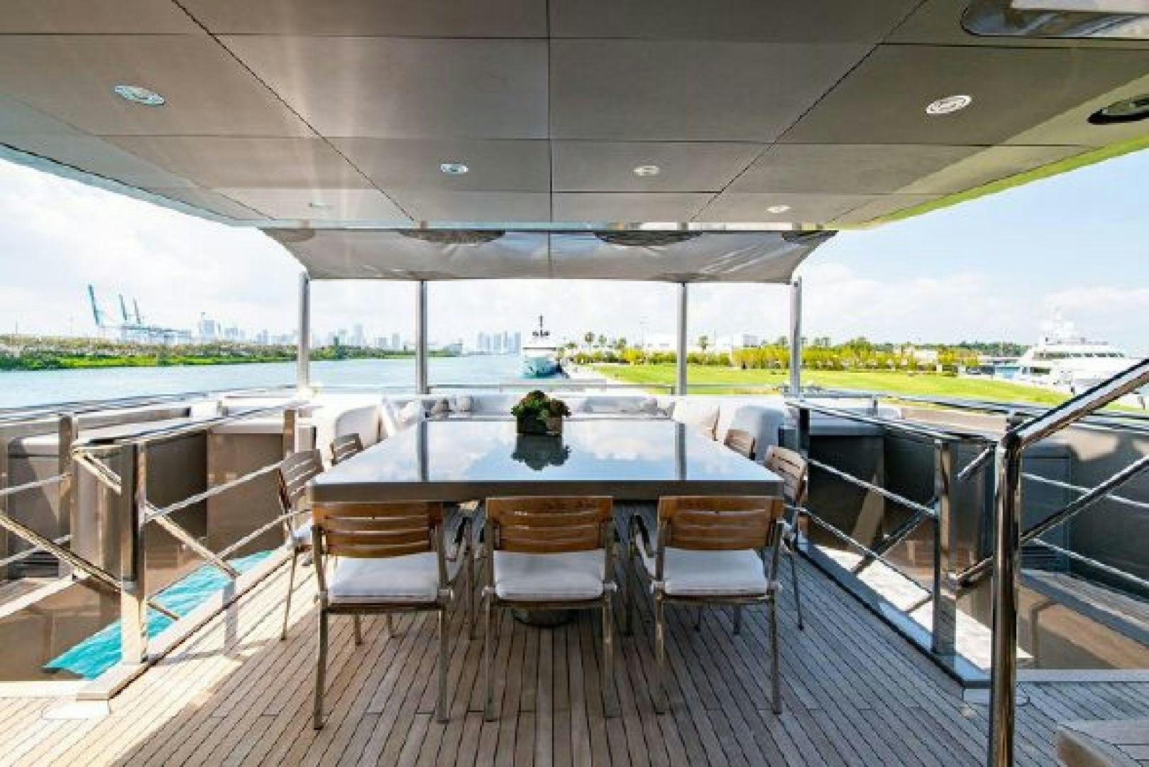 a table on a balcony aboard 174 OCEANFAST MIZU Yacht for Sale