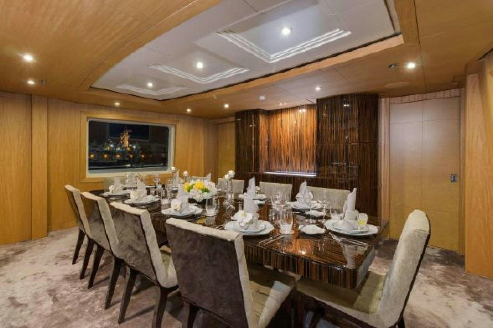 a dining room with a large table aboard 174 OCEANFAST MIZU Yacht for Sale
