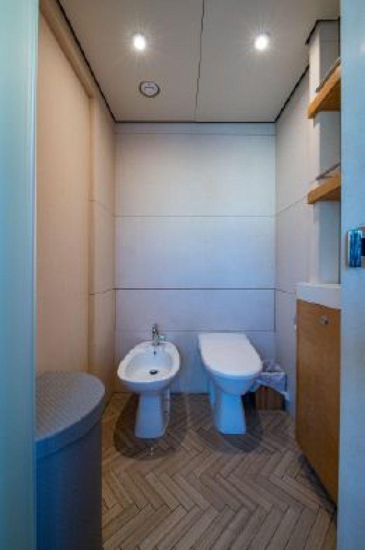 a bathroom with a toilet and a sink aboard 174 OCEANFAST MIZU Yacht for Sale