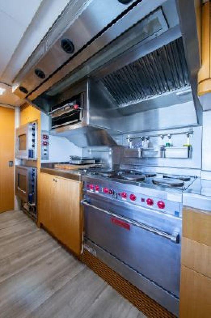 a kitchen with a stove and oven aboard 174 OCEANFAST MIZU Yacht for Sale