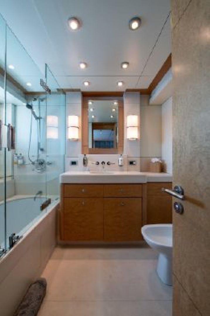 a bathroom with a glass shower aboard 174 OCEANFAST MIZU Yacht for Sale