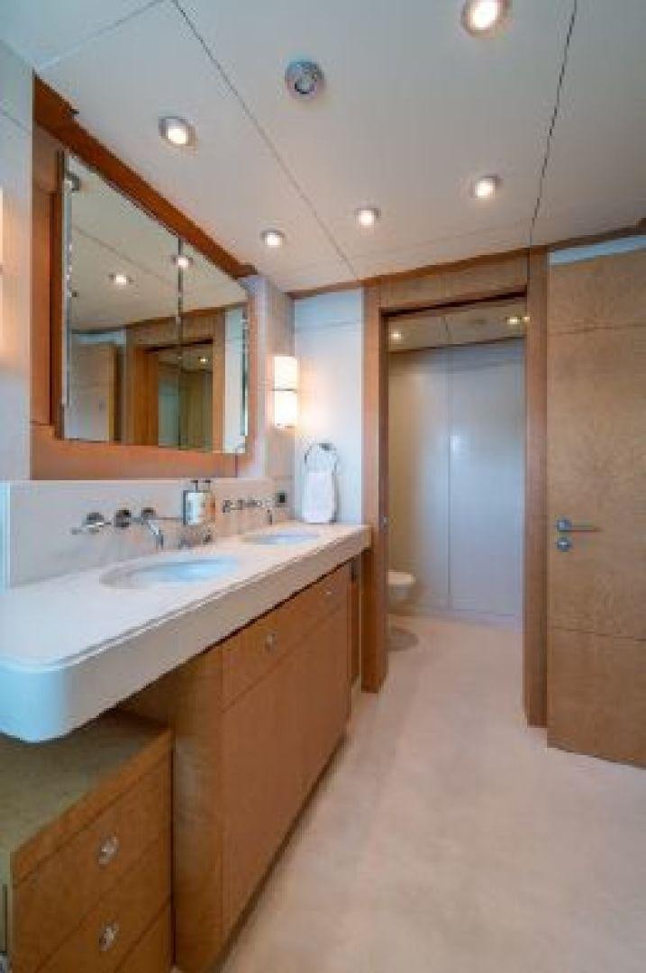 a bathroom with a sink and mirrors aboard 174 OCEANFAST MIZU Yacht for Sale