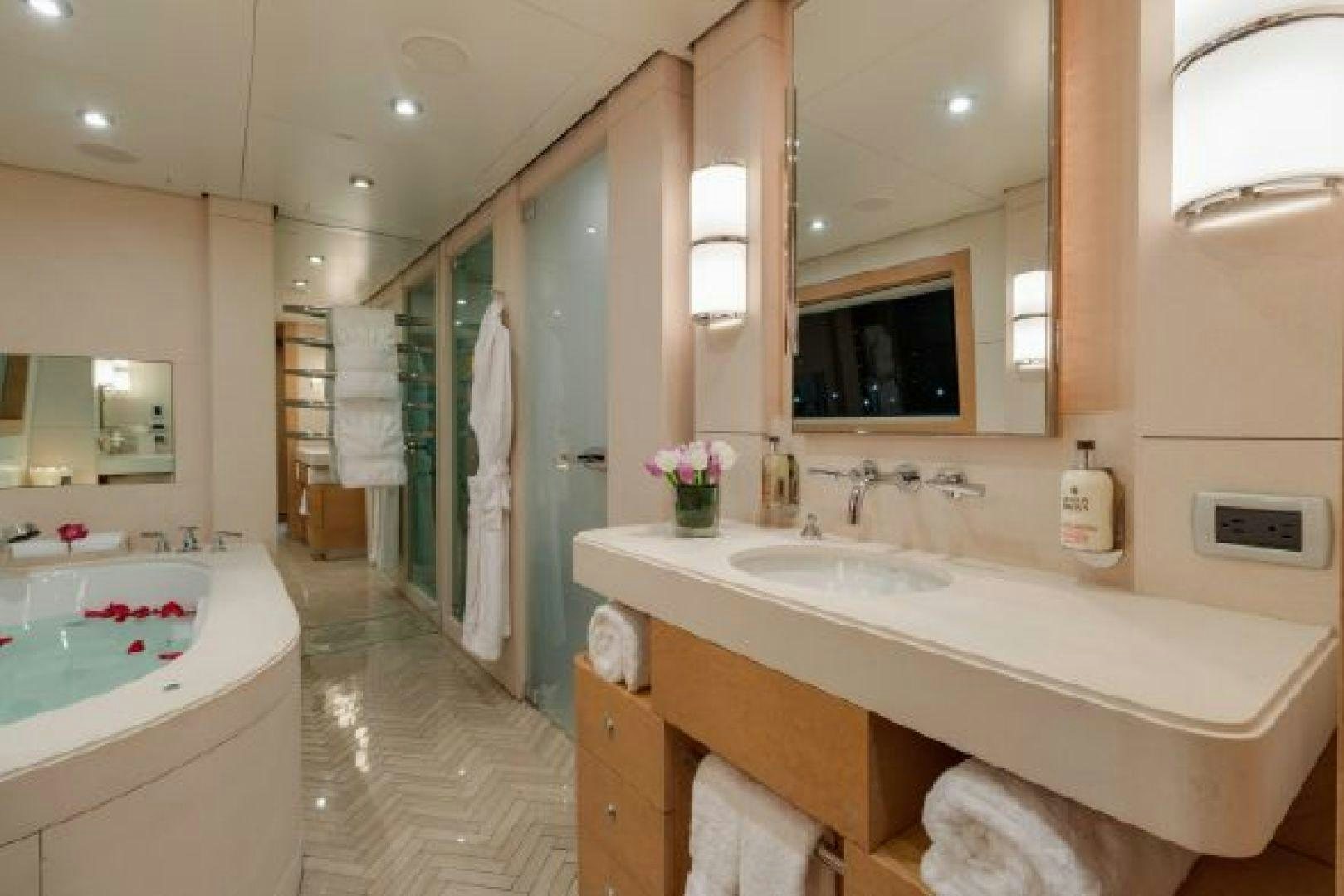 a bathroom with a sink and a mirror aboard 174 OCEANFAST MIZU Yacht for Sale