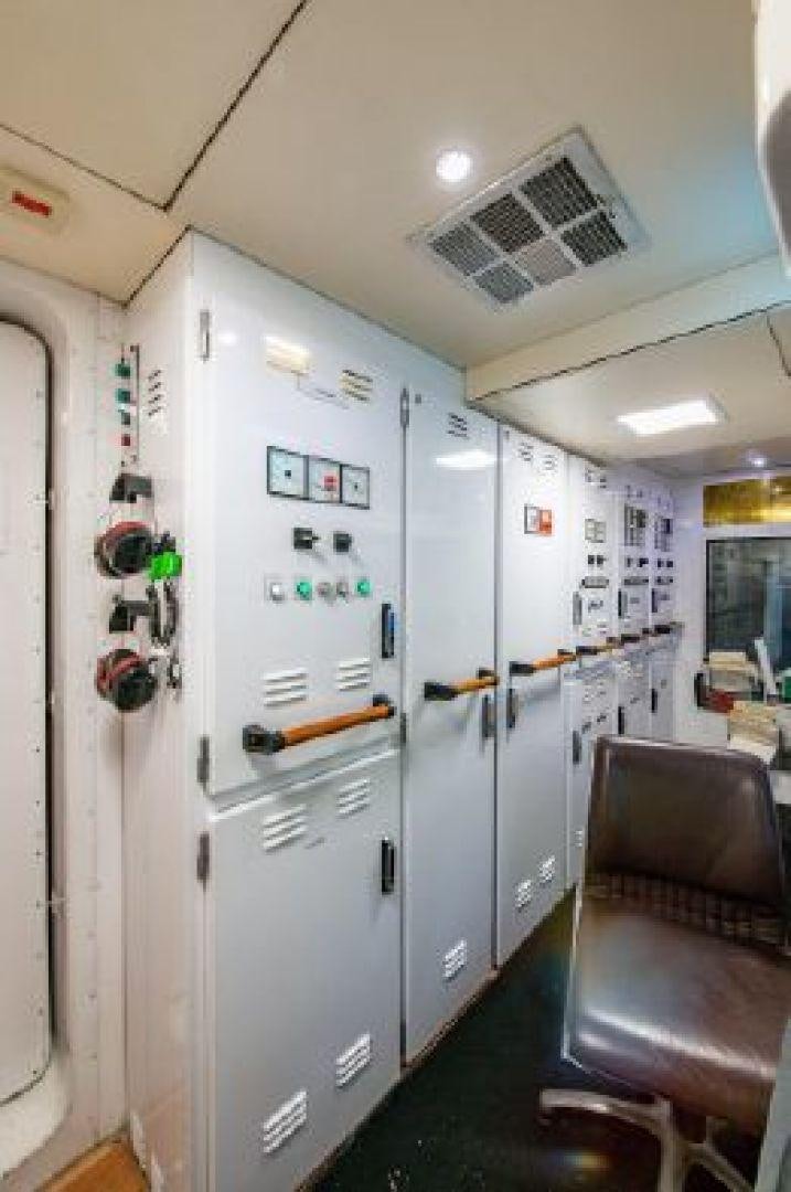 a hallway with a white door and a chair aboard 174 OCEANFAST MIZU Yacht for Sale