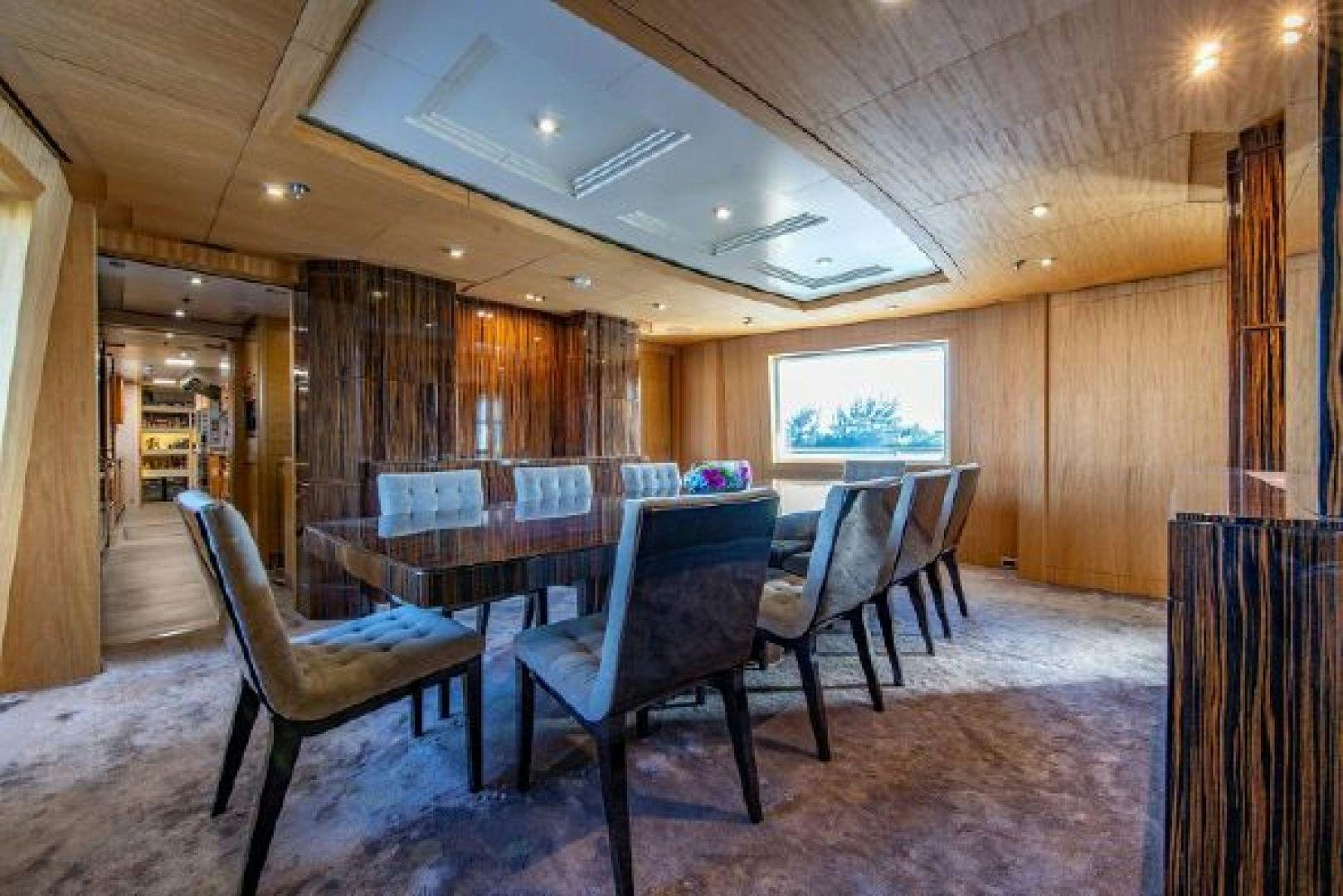 a room with a table and chairs aboard 174 OCEANFAST MIZU Yacht for Sale