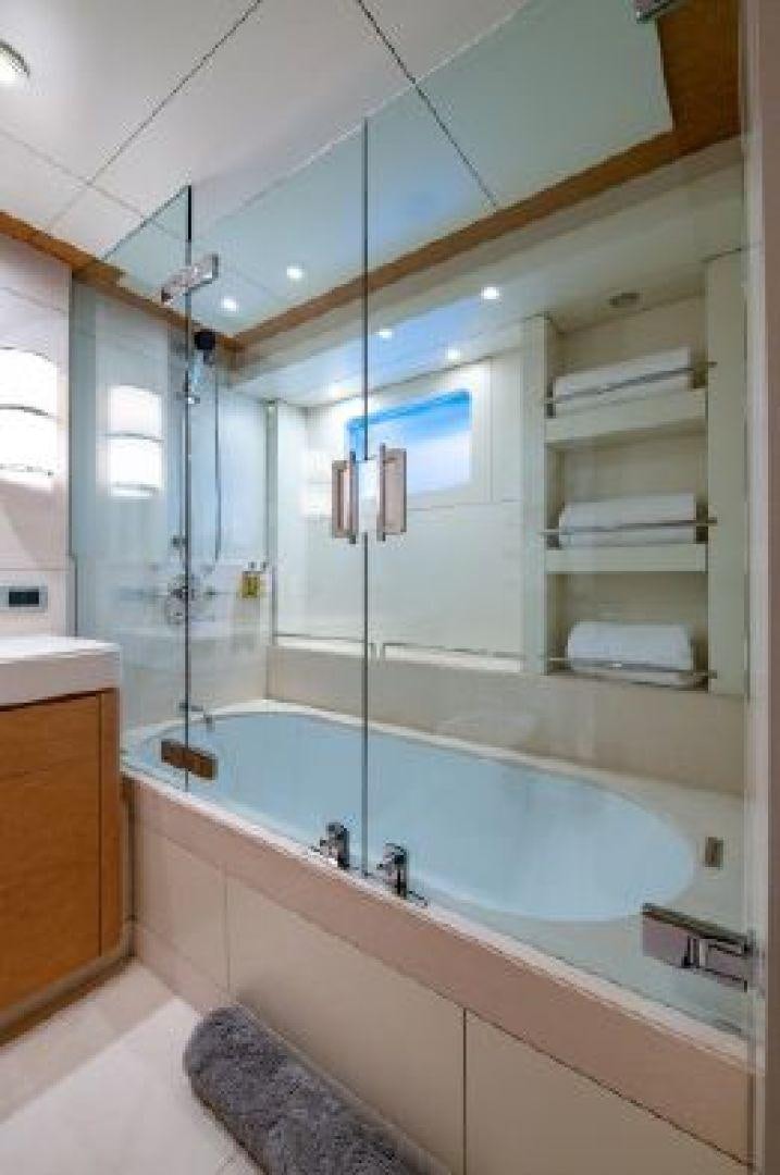 a bathroom with a large mirror aboard 174 OCEANFAST MIZU Yacht for Sale