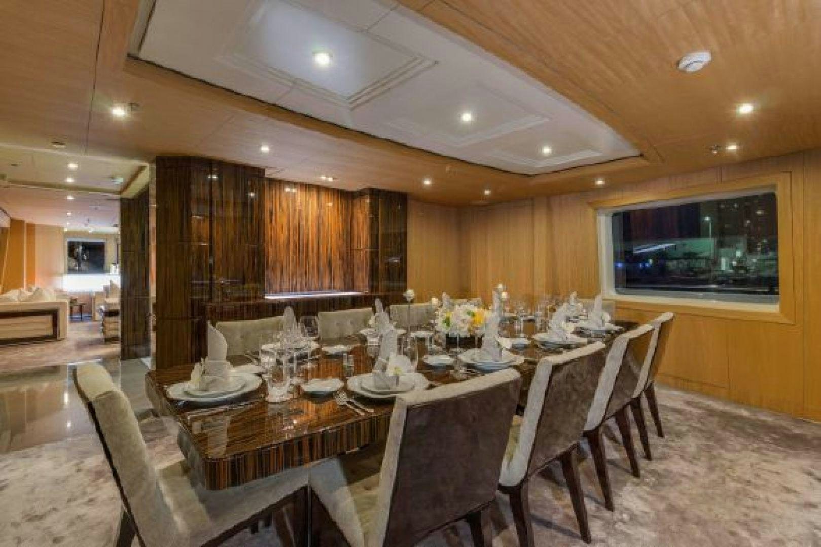 a dining room with a large table aboard 174 OCEANFAST MIZU Yacht for Sale