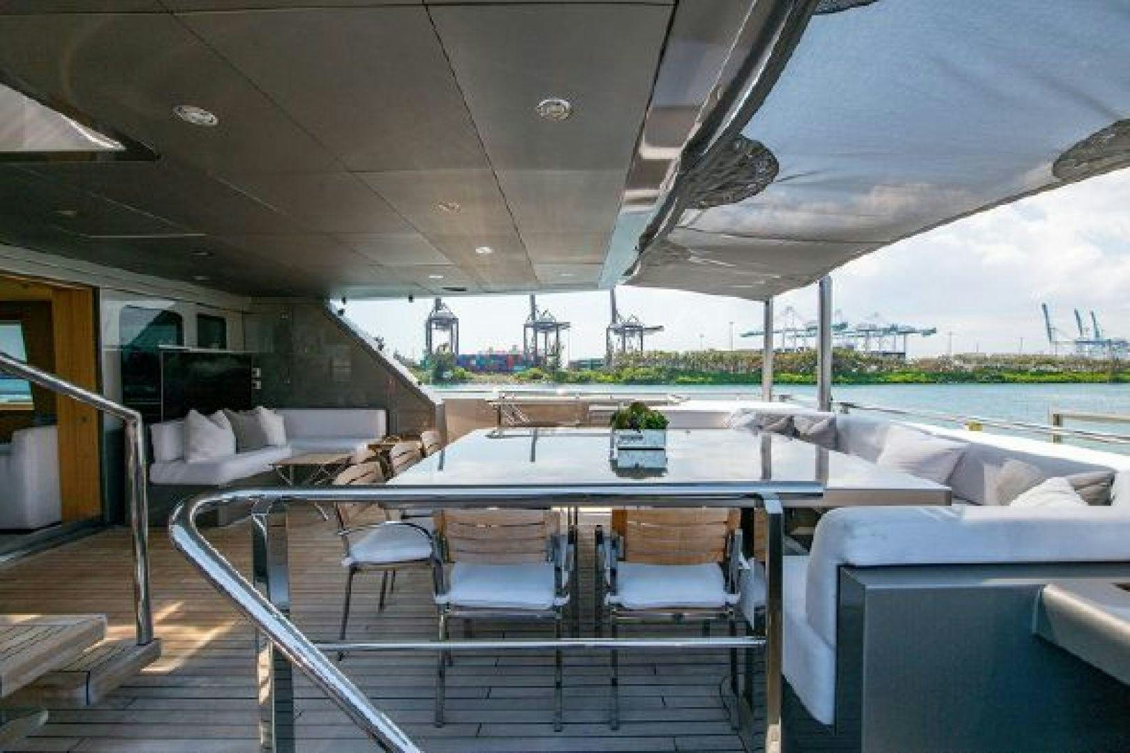 a large white table with chairs around it aboard 174 OCEANFAST MIZU Yacht for Sale