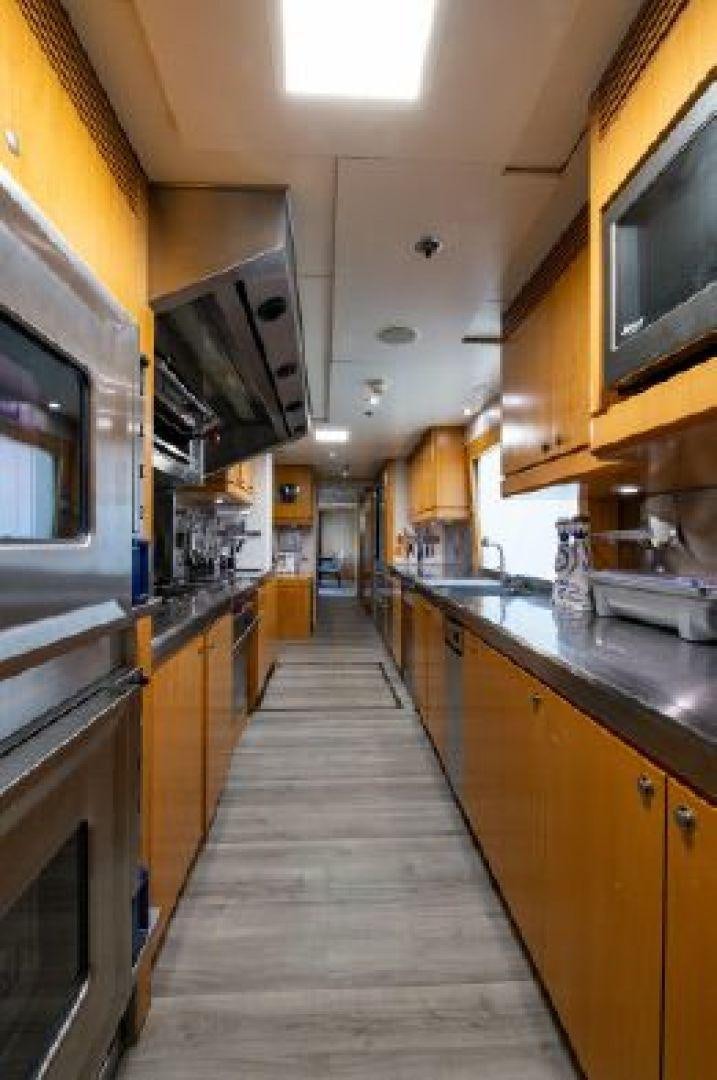 a kitchen with a long wooden hallway aboard 174 OCEANFAST MIZU Yacht for Sale