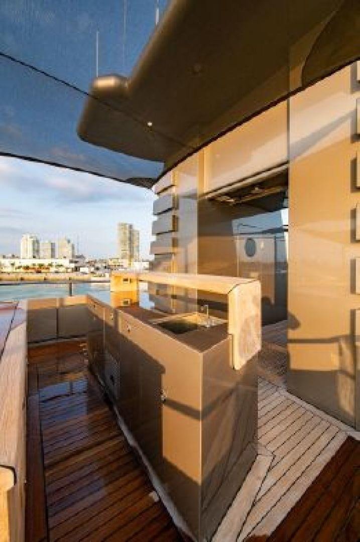 a wood deck overlooking a city aboard 174 OCEANFAST MIZU Yacht for Sale