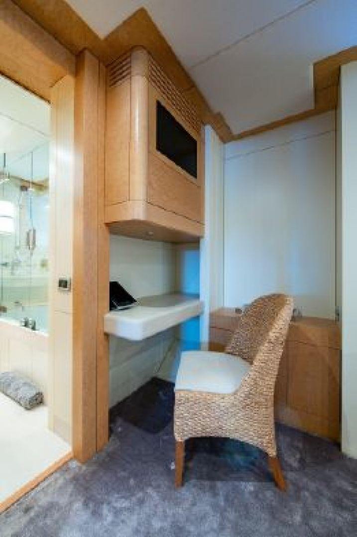 a chair and a desk in a room aboard 174 OCEANFAST MIZU Yacht for Sale