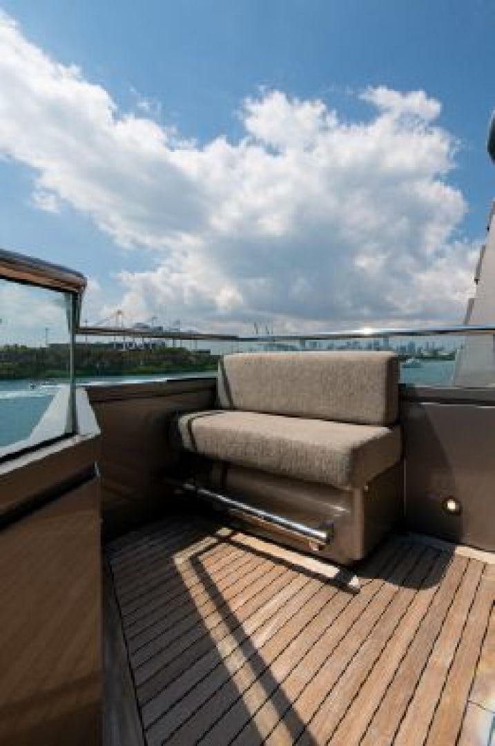 a couch on a deck overlooking a body of water aboard 174 OCEANFAST MIZU Yacht for Sale