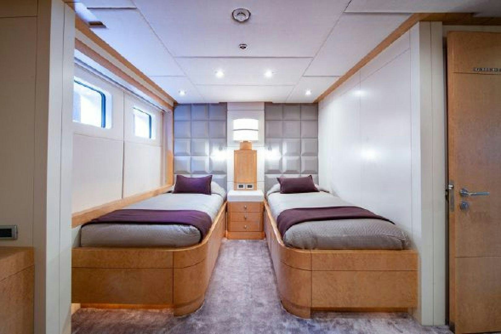 a bedroom with a bed and a desk aboard 174 OCEANFAST MIZU Yacht for Sale