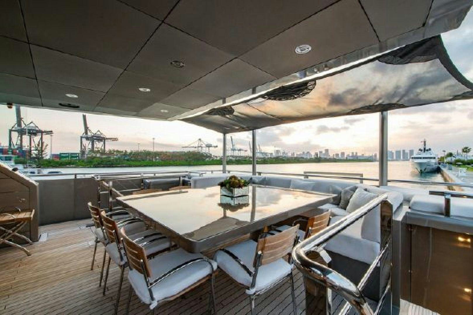 a table and chairs on a deck aboard 174 OCEANFAST MIZU Yacht for Sale