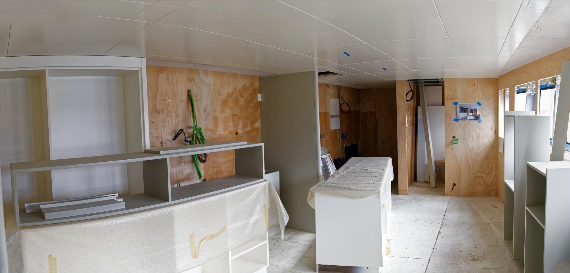 a room with white cabinets and a plant in it aboard NO NAME Yacht for Sale