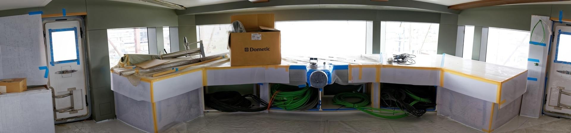 a room with a table and boxes aboard NO NAME Yacht for Sale