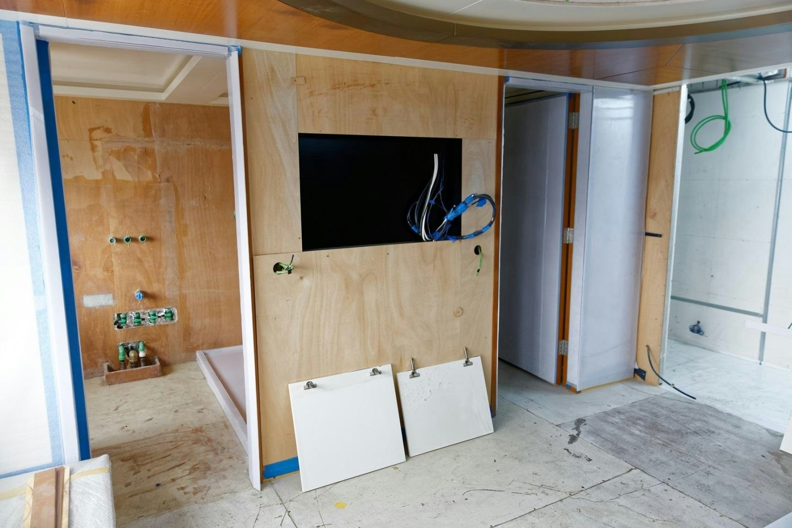 a room with a tv and a closet aboard NO NAME Yacht for Sale