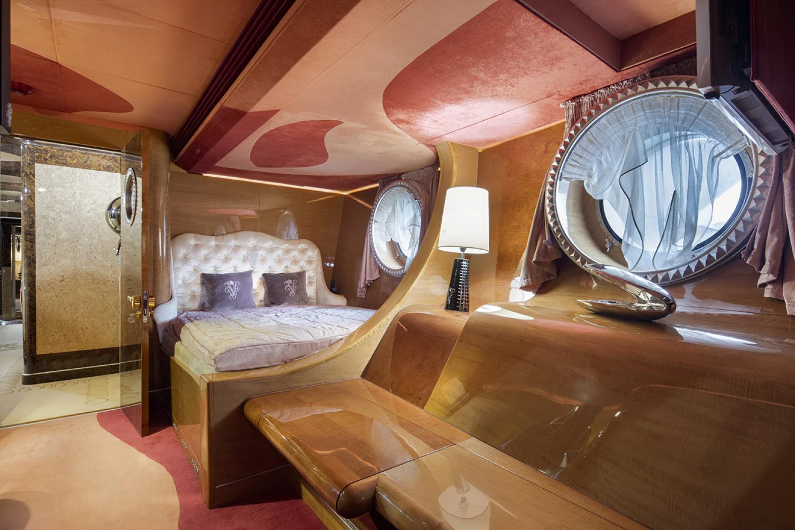 a room with a bed and a fan aboard THUNDER Yacht for Sale
