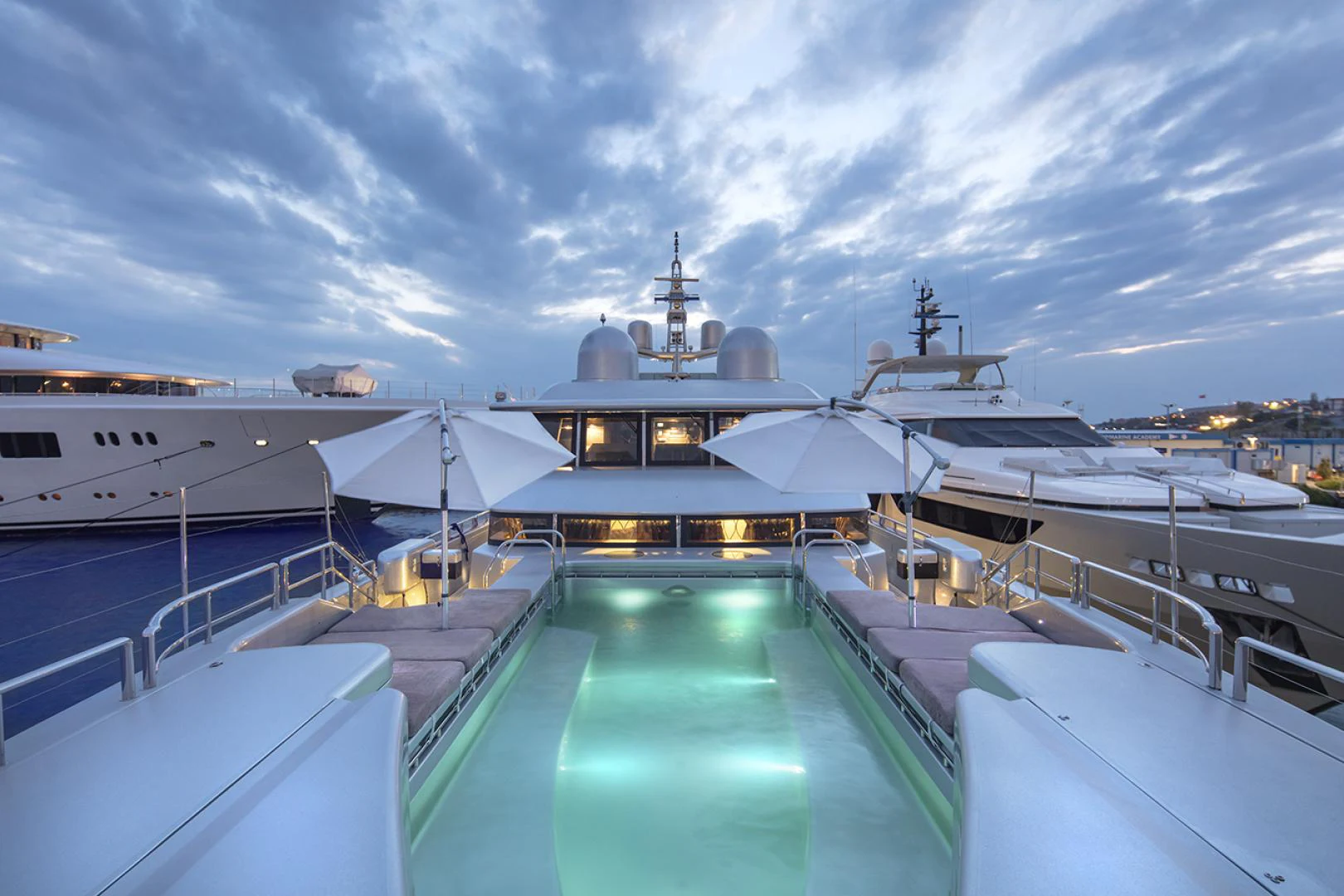 a large cruise ship docked aboard THUNDER Yacht for Sale