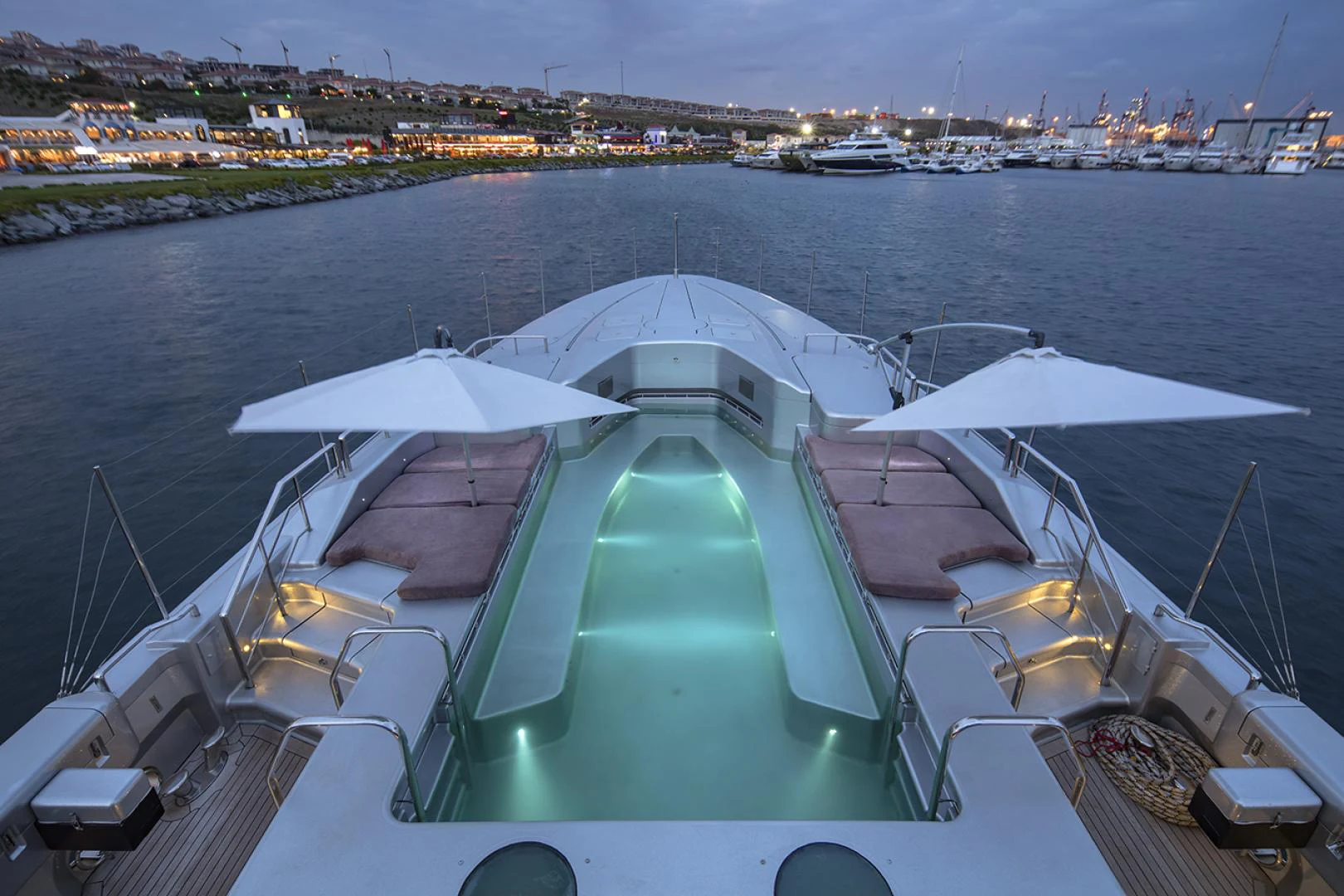 a large cruise ship docked aboard THUNDER Yacht for Sale