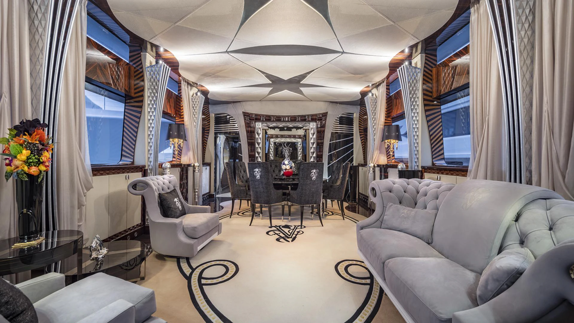 a living room with a couch and chairs aboard THUNDER Yacht for Sale