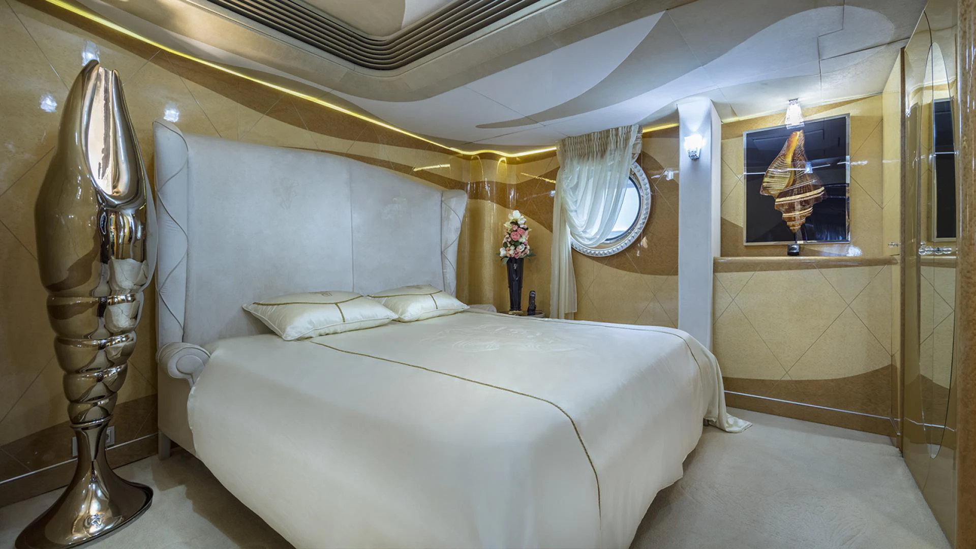a bed with a white bed spread aboard THUNDER Yacht for Sale
