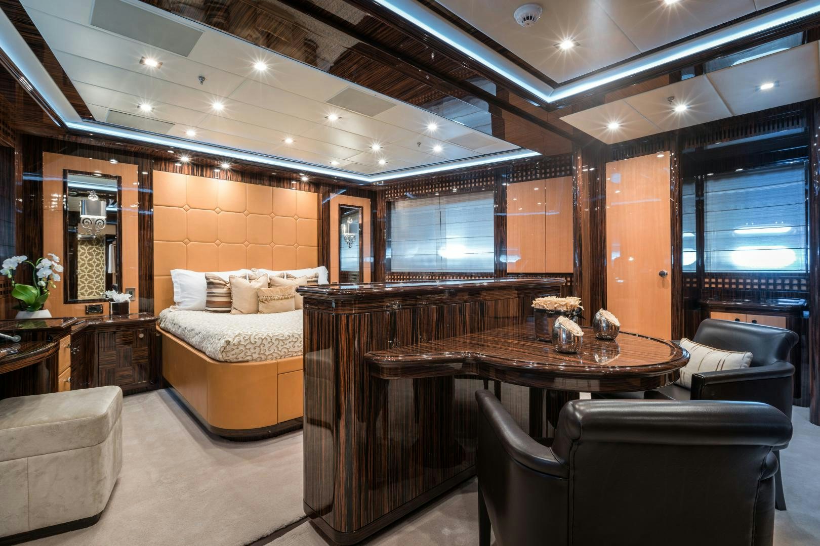a room with a couch and a table aboard SERENITY Yacht for Sale