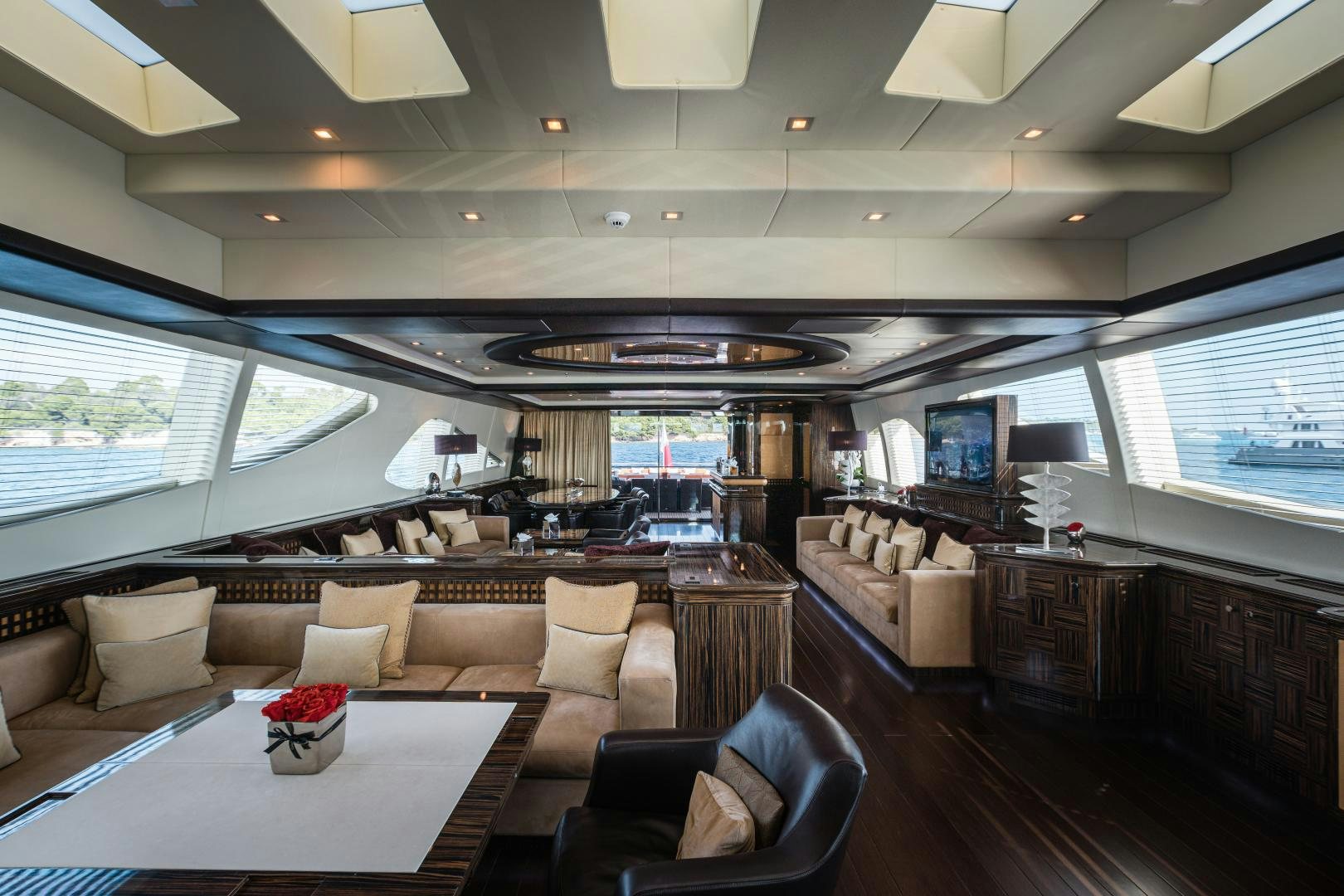 a living room with a large window aboard SERENITY Yacht for Sale