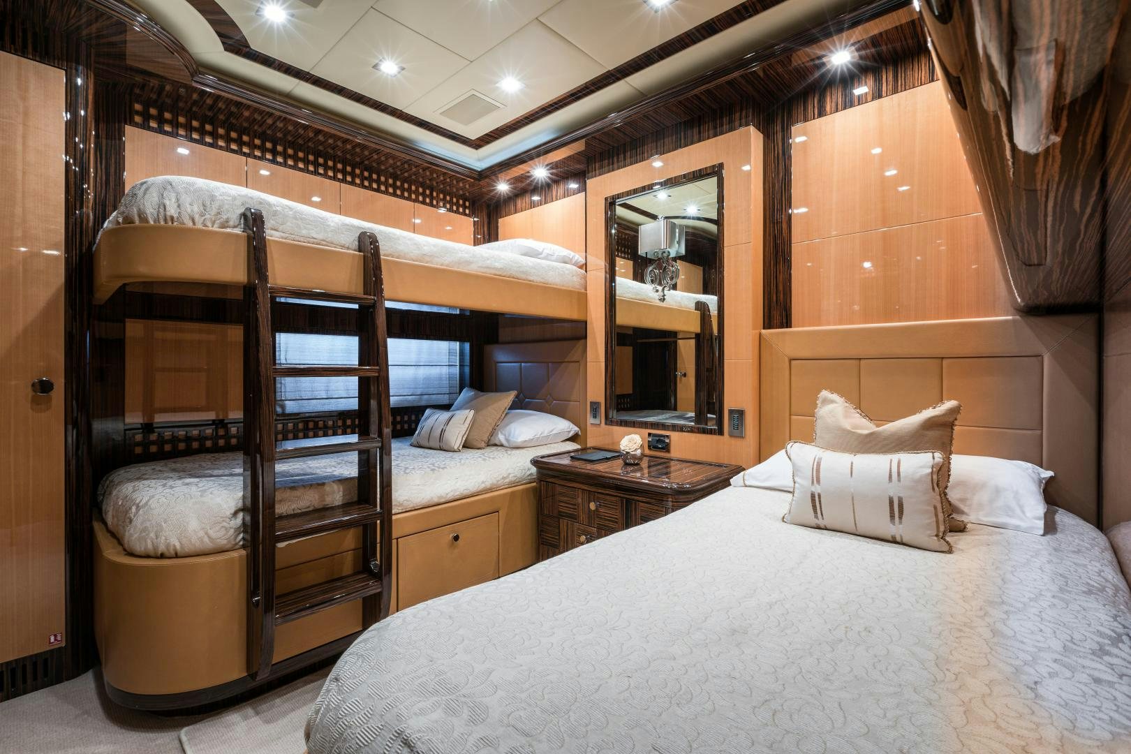a bed with a wood frame aboard SERENITY Yacht for Sale