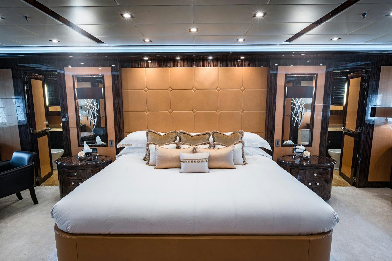 a large bed in a hotel room aboard SERENITY Yacht for Sale