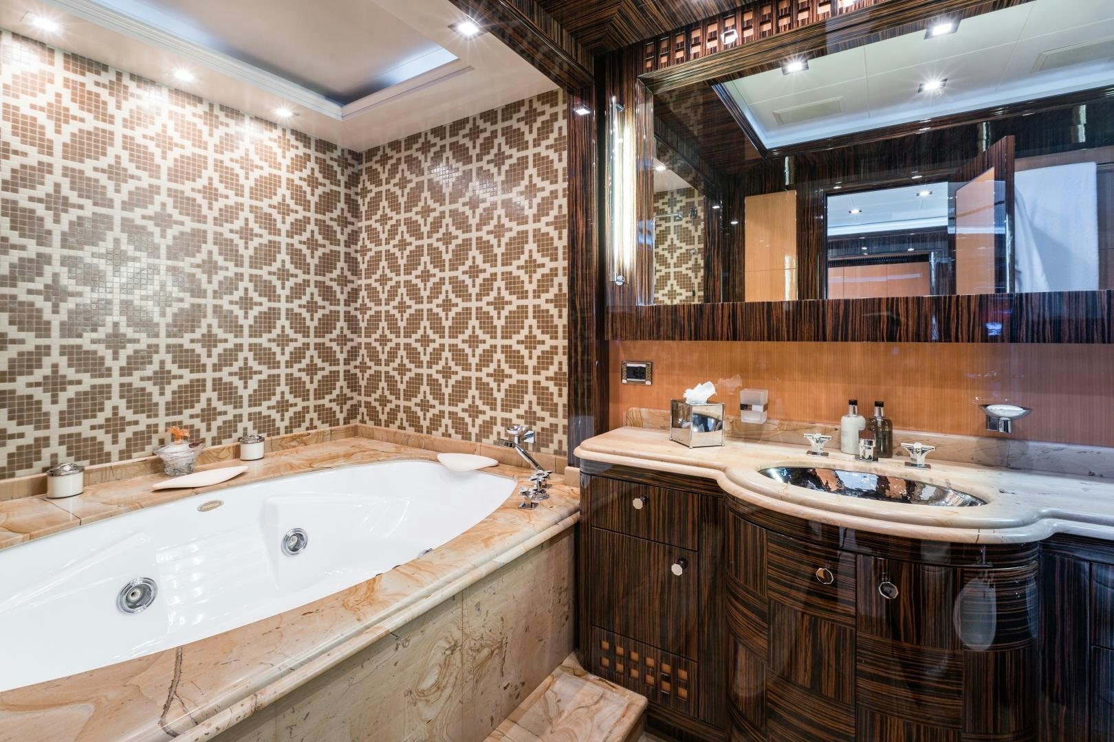 a bathroom with a large bathtub aboard SERENITY Yacht for Sale