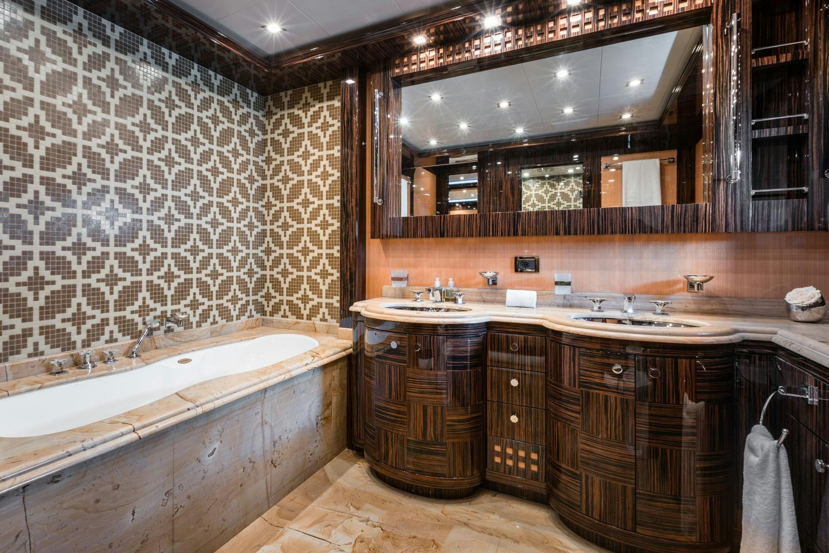 a bathroom with a large mirror aboard SERENITY Yacht for Sale