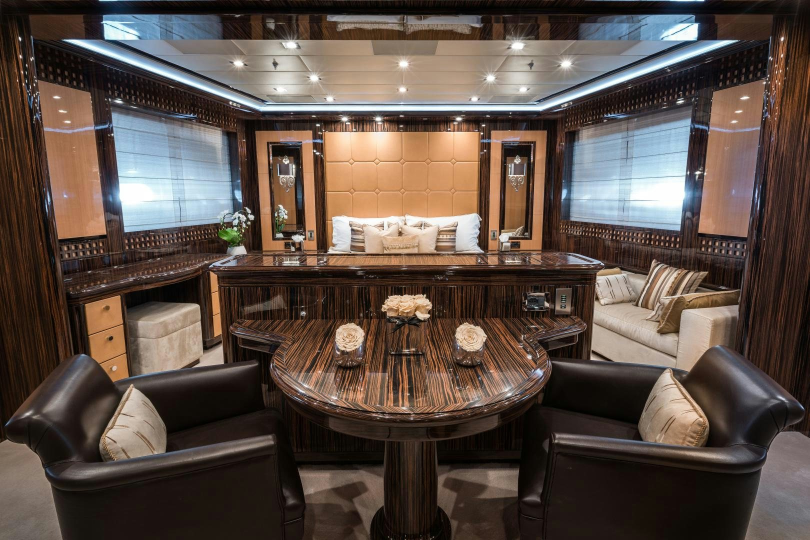 a large room with a table and chairs aboard SERENITY Yacht for Sale