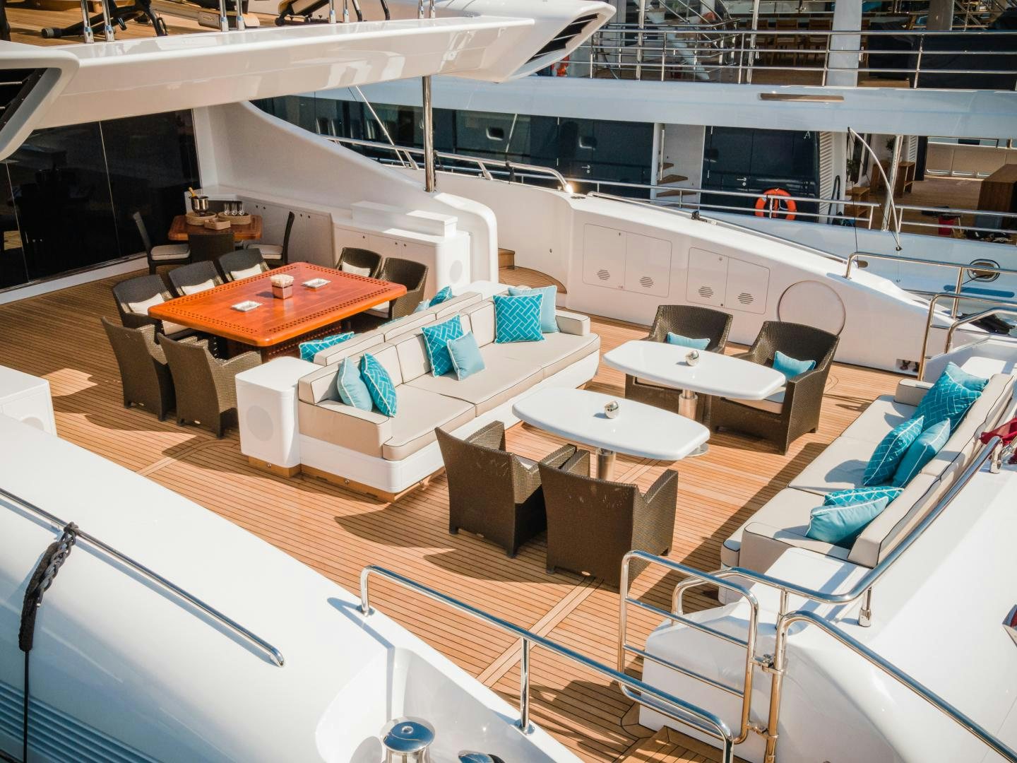 a room with tables and chairs aboard SERENITY Yacht for Sale
