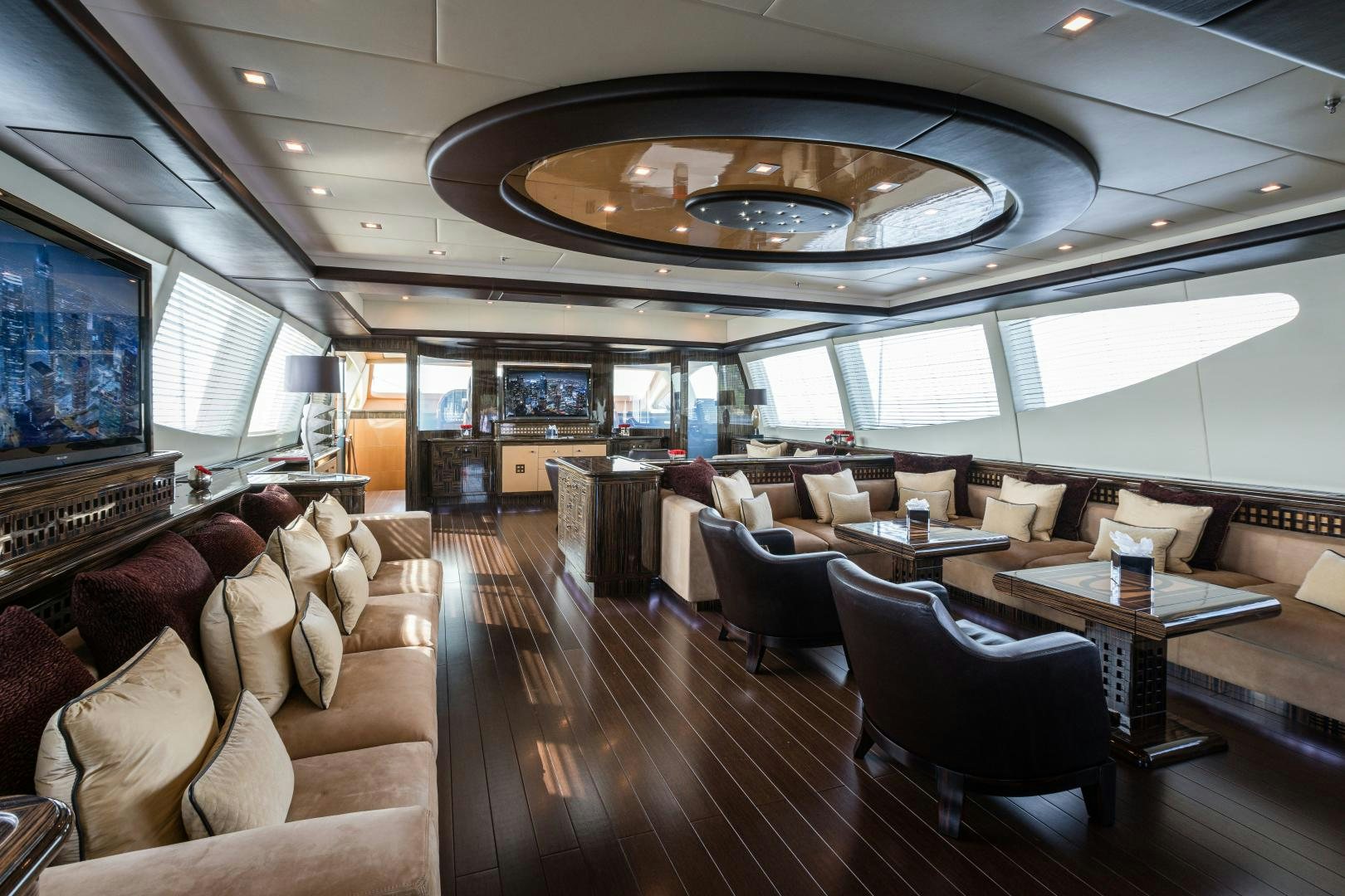 a large room with a large screen aboard SERENITY Yacht for Sale