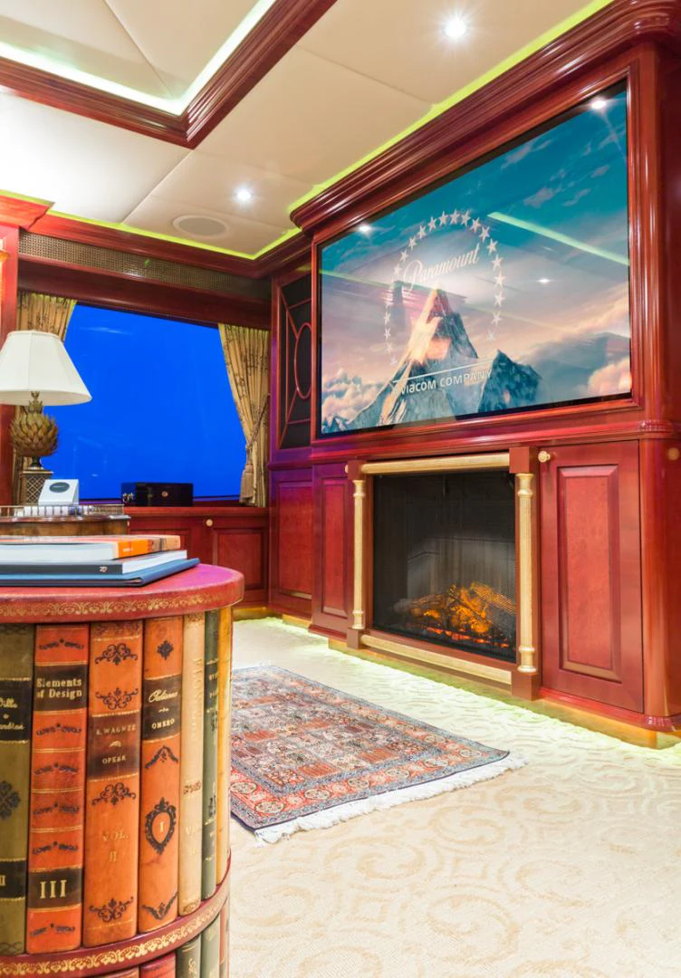 a room with a fireplace and a tv aboard AMARULA SUN Yacht for Sale