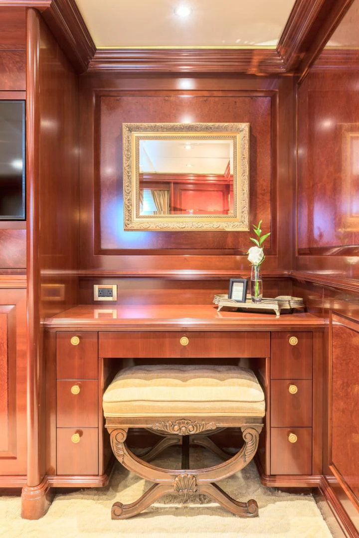 a wooden vanity with a mirror above it aboard AMARULA SUN Yacht for Sale