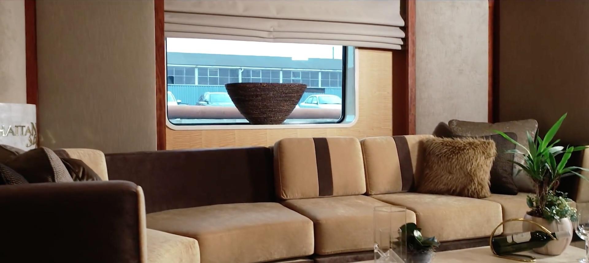 a couch and a window aboard ANNA J Yacht for Sale