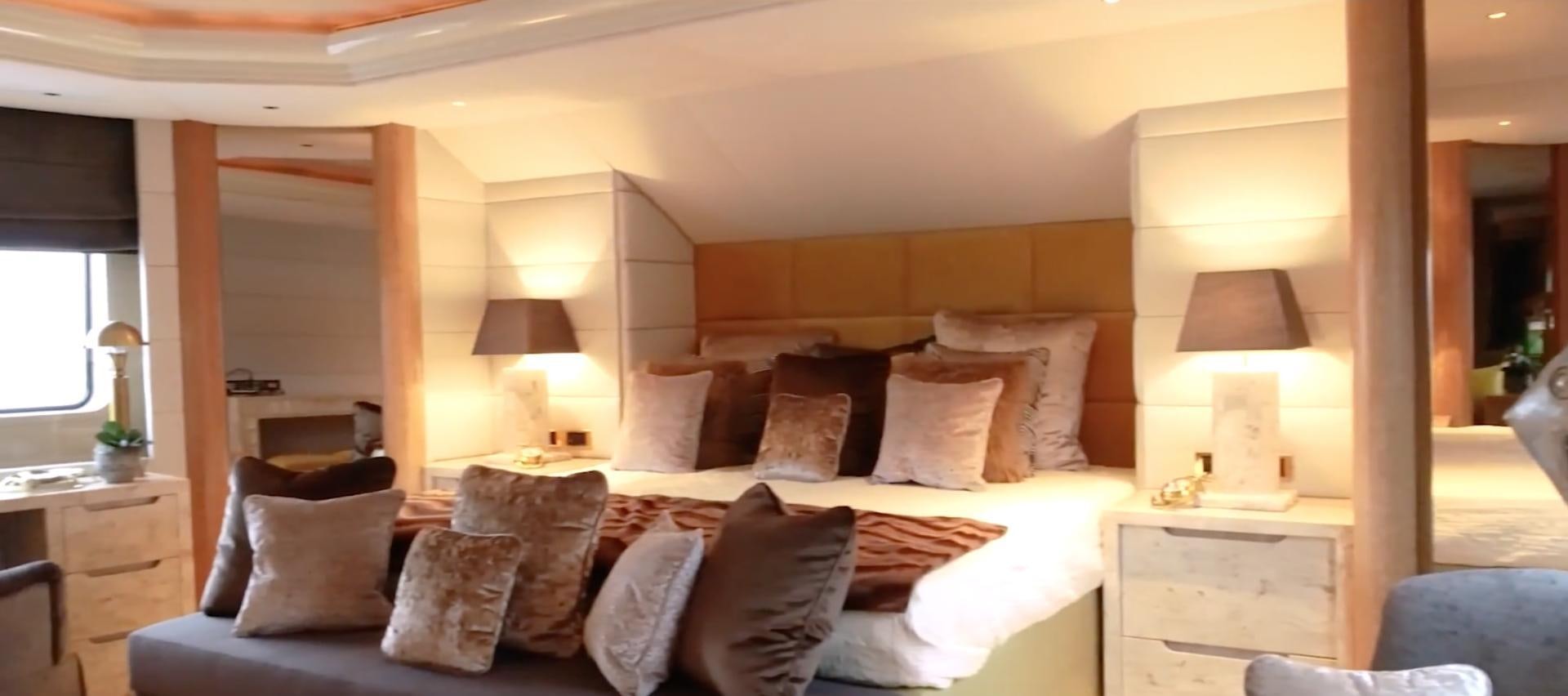 a large bed with pillows aboard ANNA J Yacht for Sale