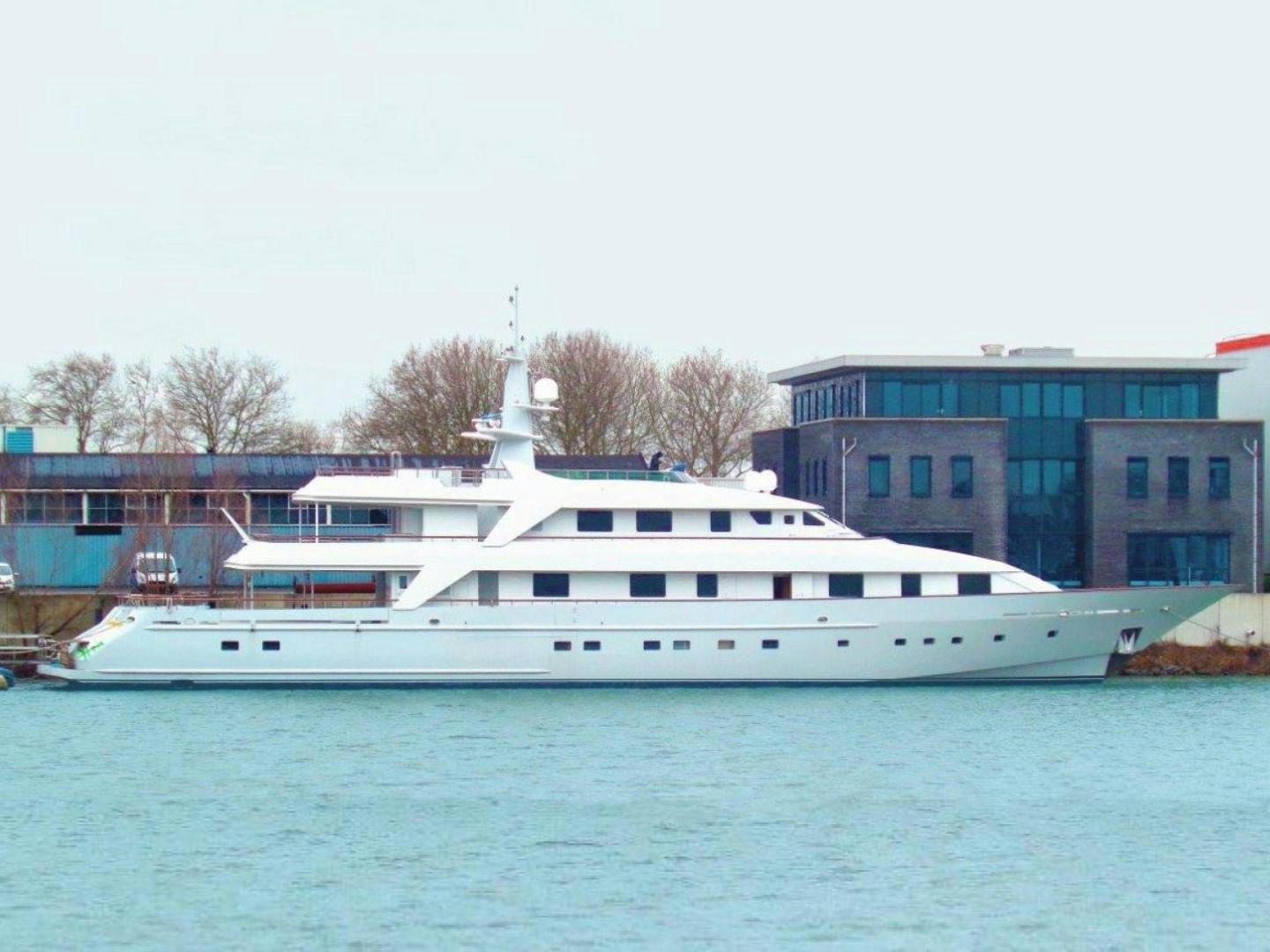 a white boat in a body of water aboard ANNA J Yacht for Sale